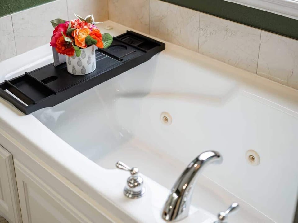 Spotless bathrooms with tub/shower combos, plush towels & essential toiletries—everything you need for a comfortable stay.