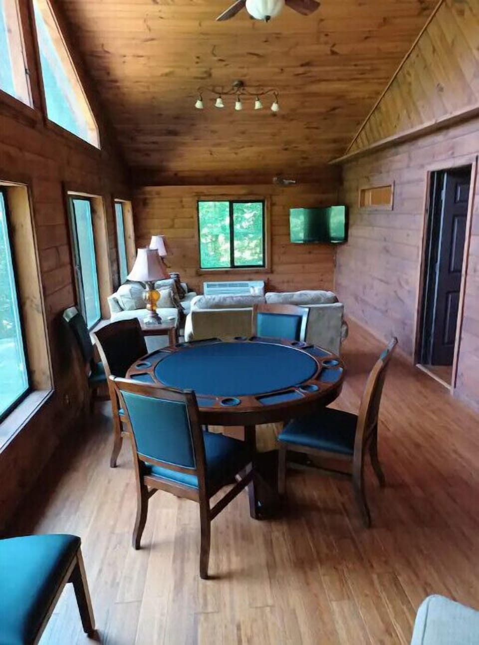 game room - poker table or bumper pool table - has a big screen