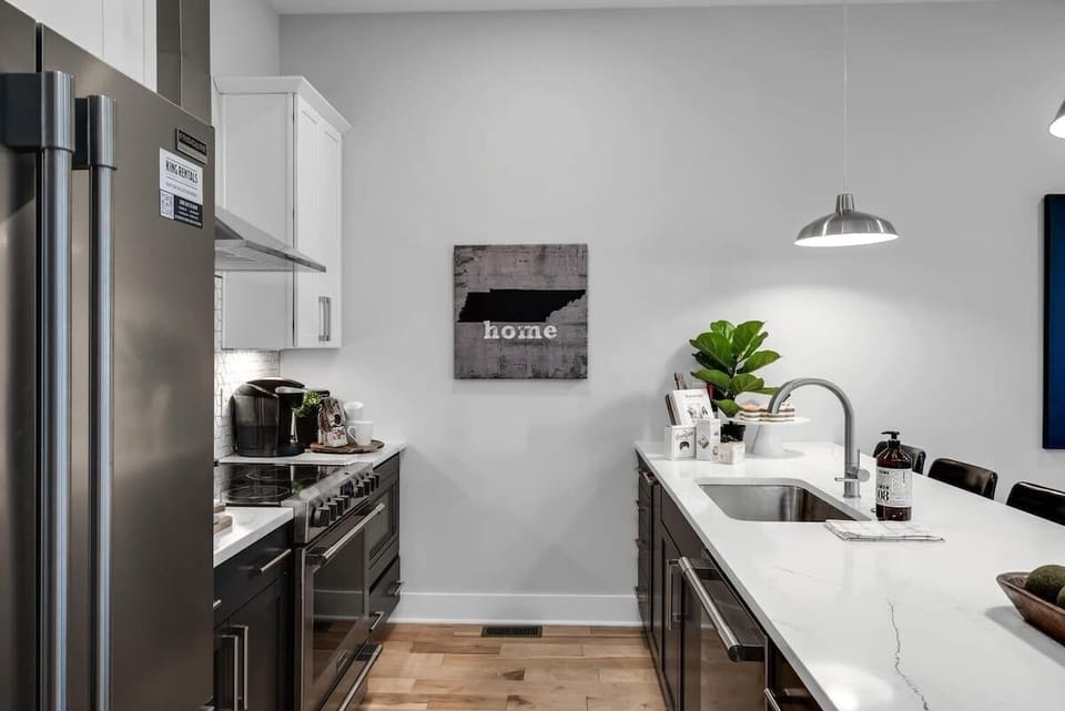 Functional kitchen with all essentials plus island counter.