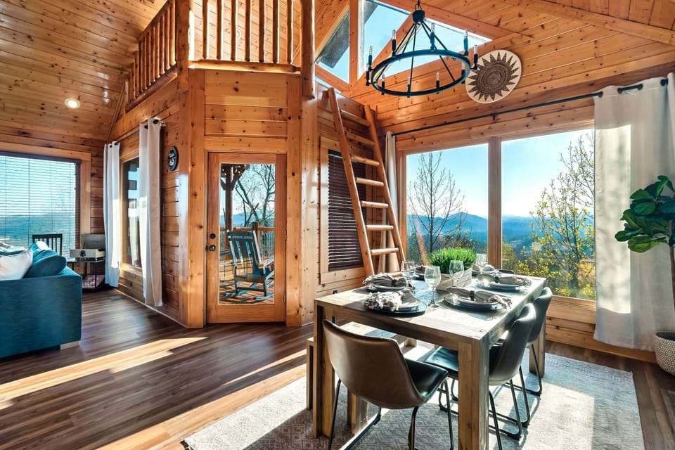 Dining room flanked by large picture windows is the perfect gathering place