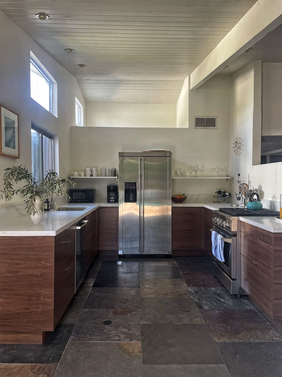 Chef's kitchen with modern appliances, generous prep space and open sightlines.