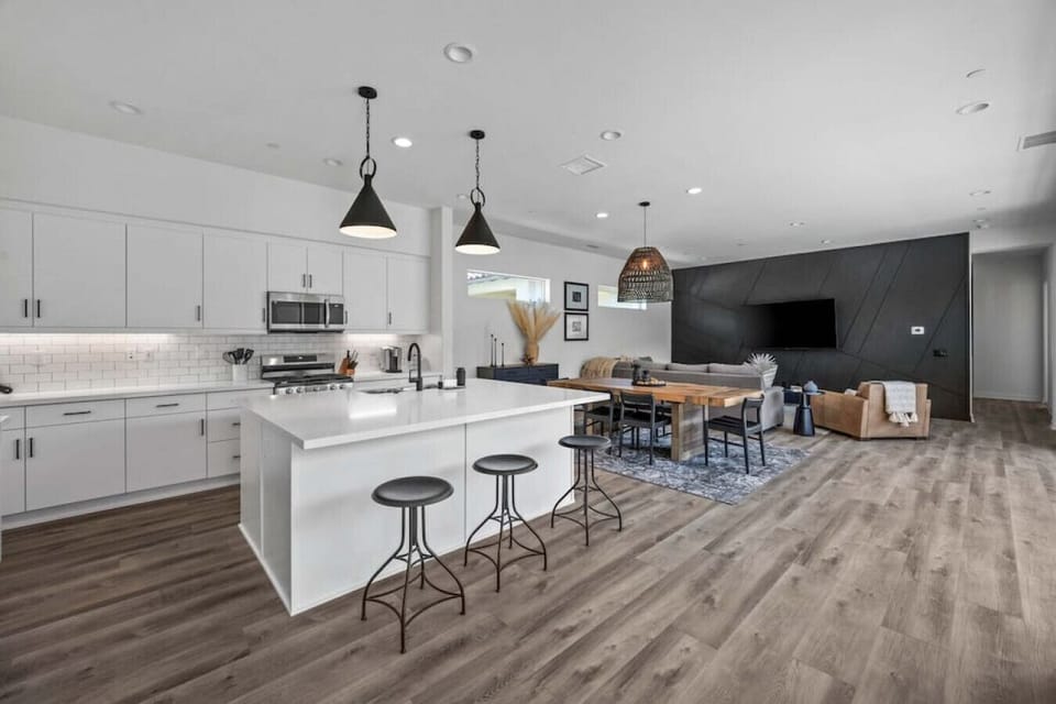 Spacious open kitchen & living area w/ island seating & plenty of room to gather