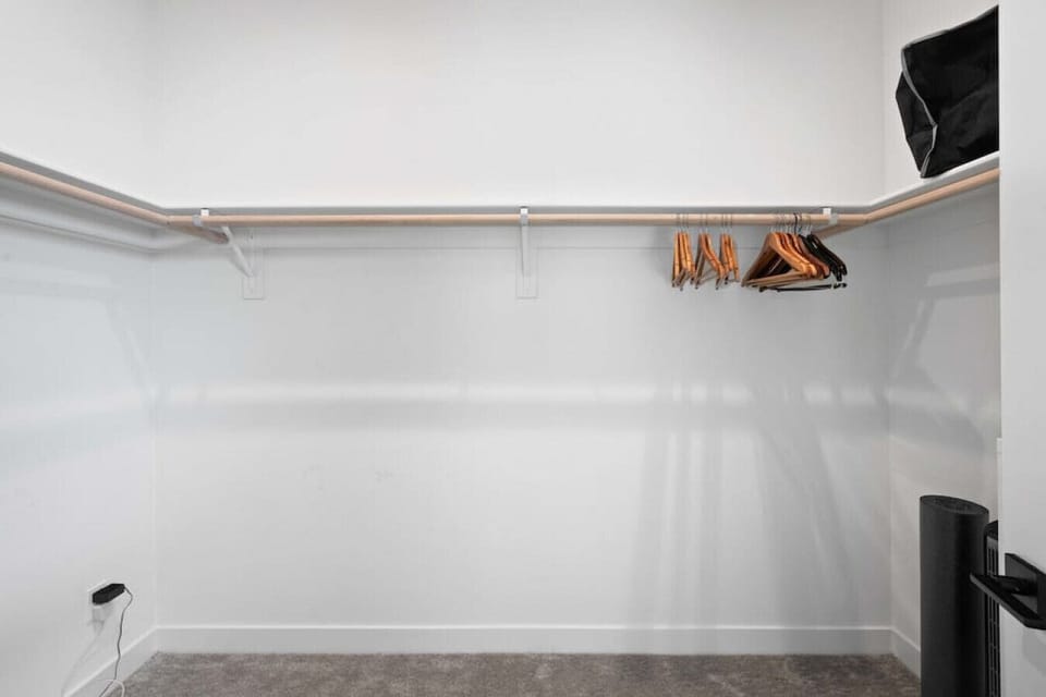 Spacious walk-in closet w/ hanging space & shelves to keep everything organized