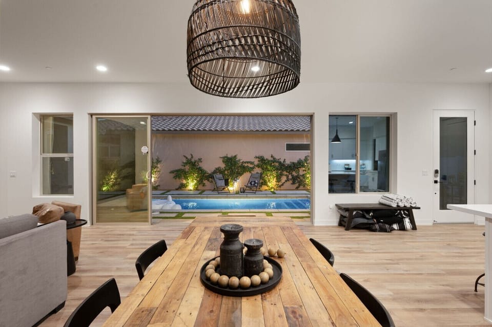 Enjoy indoor dining w/ a view, as large doors open to the softly lit outdoor space