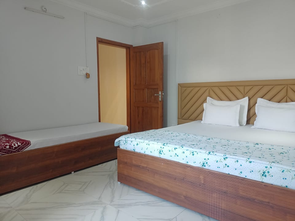 Standard Triple Room | Desk, blackout drapes, iron/ironing board