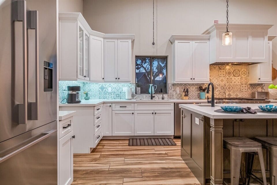 This kitchen includes a prep sink in the expansive island.