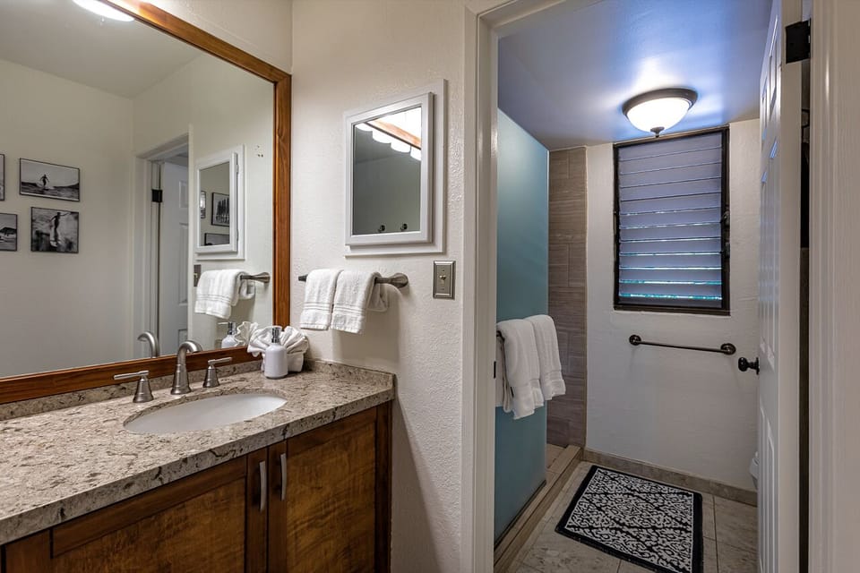 Primary en suite bathroom with spacious vanity area. 