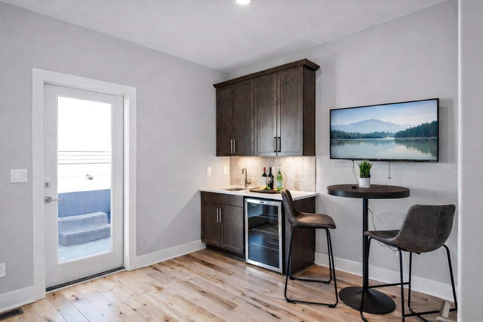 Top-floor wet bar with direct access to the rooftop patio.