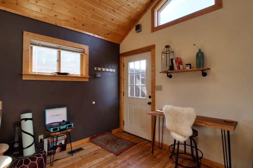 【Interior】 Warm lodge interior — wood tones, quiet, ready for a couple + a dog.