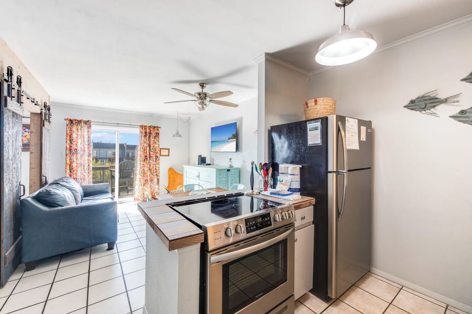 Your open-concept space flows seamlessly from kitchen to living room, creating a perfect hub for relaxing and entertaining.
