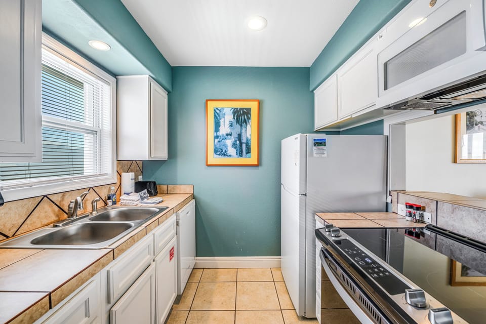 Your fully equipped kitchen features modern appliances and ample counter space for preparing meals during your stay.
