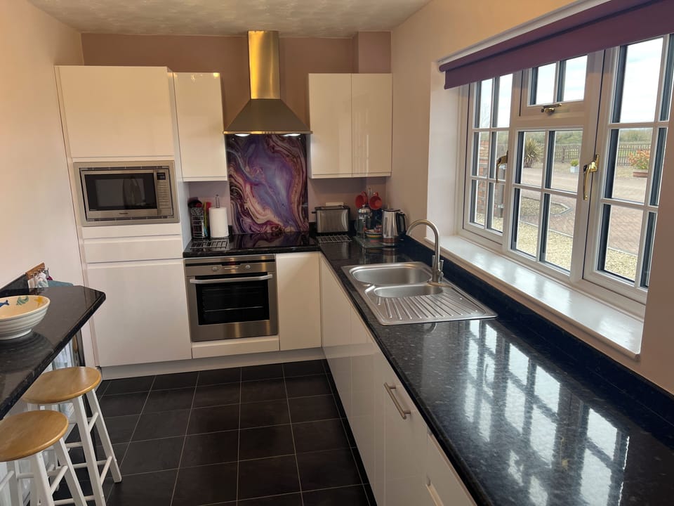 Fully fitted kitchen with breakfast bar