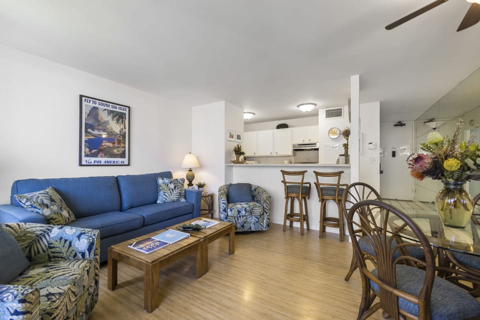 Unwind in your open-plan living space, where tropical-inspired furnishings and a fully equipped kitchen create the perfect home base for your island getaway.