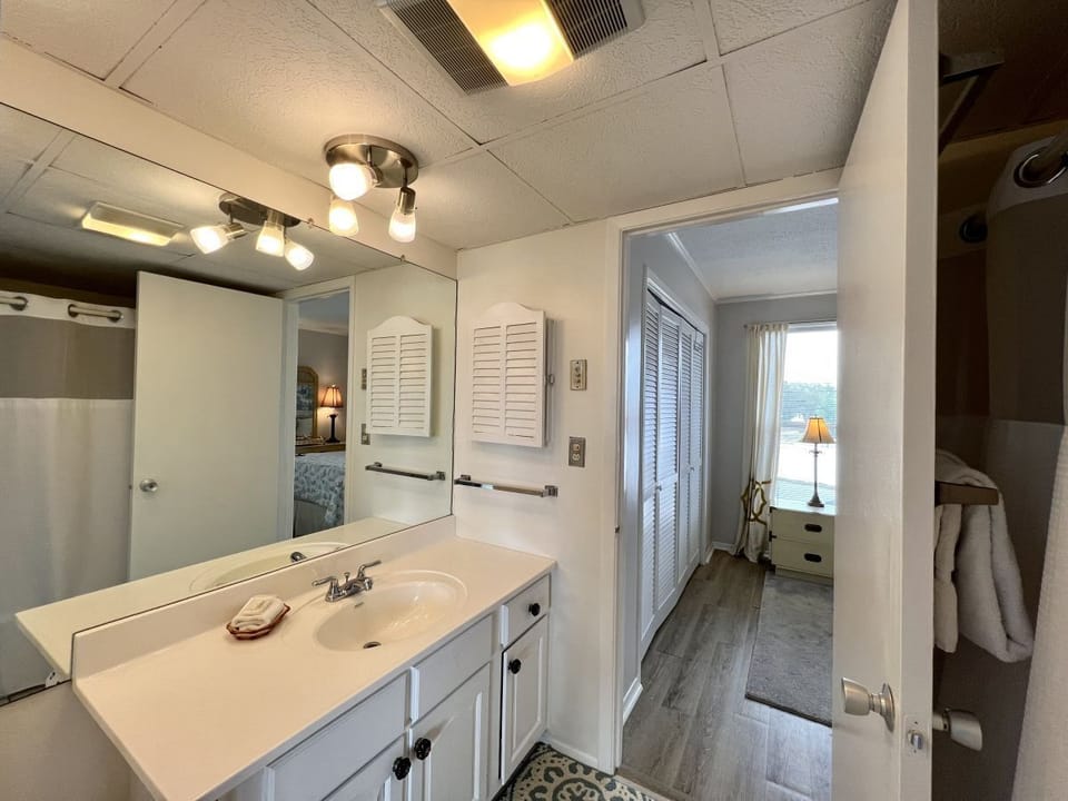 Step into your bright, well-appointed bathroom with vanity space and thoughtful lighting that makes morning routines feel effortless.