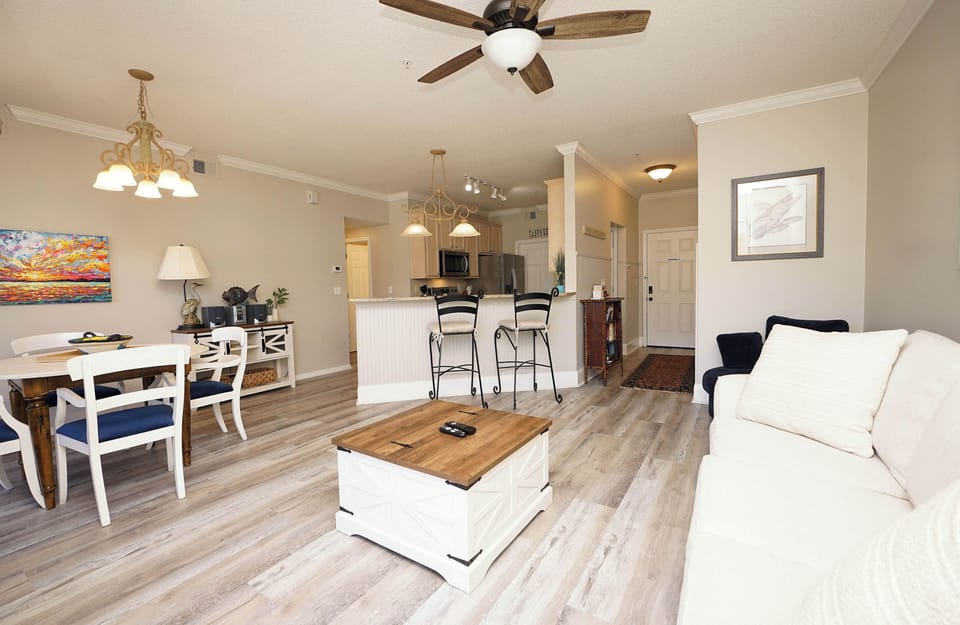Unwind in your open-concept living space with coastal touches, modern comforts, and everything you need for a perfect getaway.