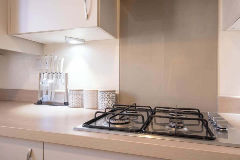 A well-equipped kitchen with all the essentials for your stay, including a washing machine