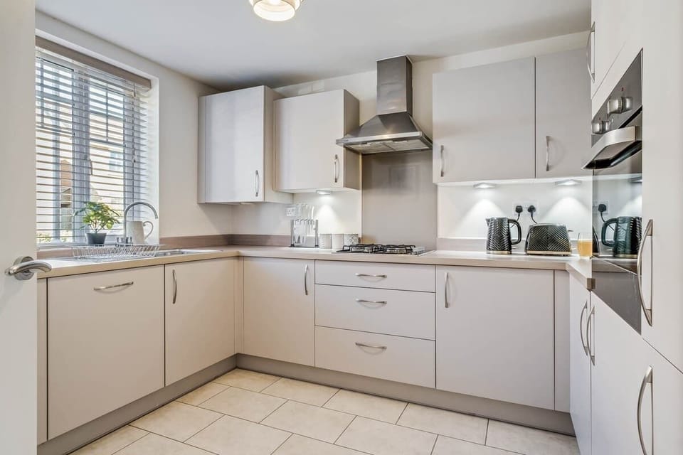 A well-equipped kitchen with all the essentials for your stay, including a washing machine