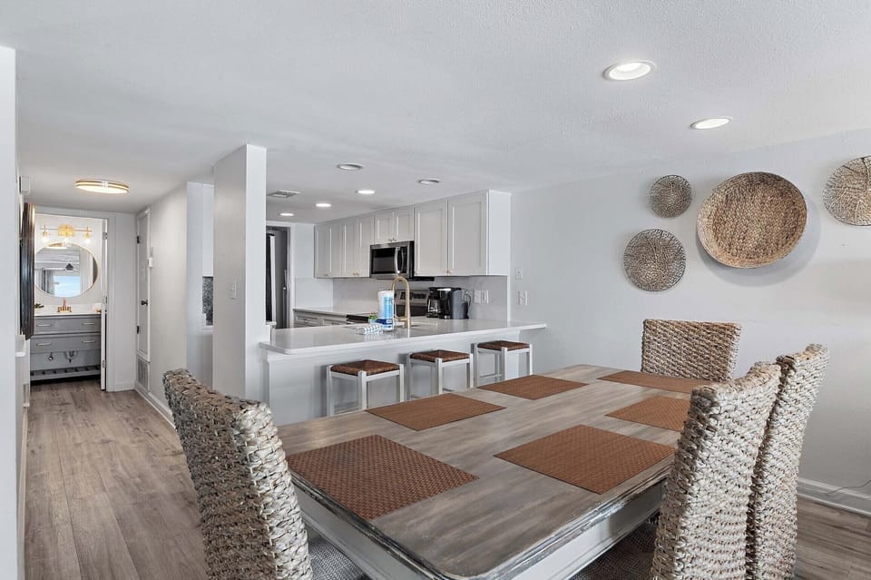 Eat-in kitchen bar has seating for three