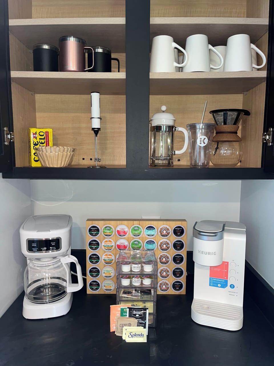 Regular and decaf Kcups, cream, sugar, sweetener, and tea.