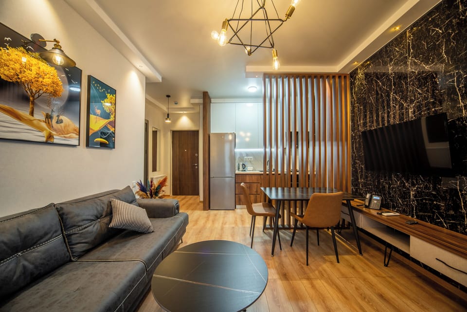Superior Apartment, Non Smoking | Living room | Flat-screen TV