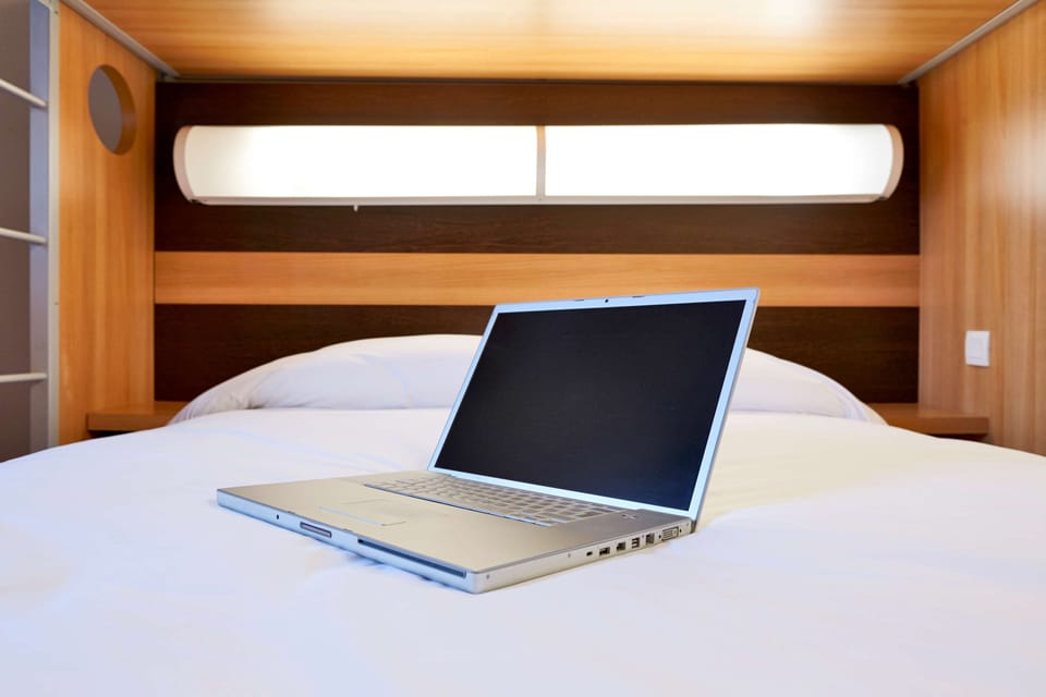 Premium bedding, desk, blackout drapes, soundproofing