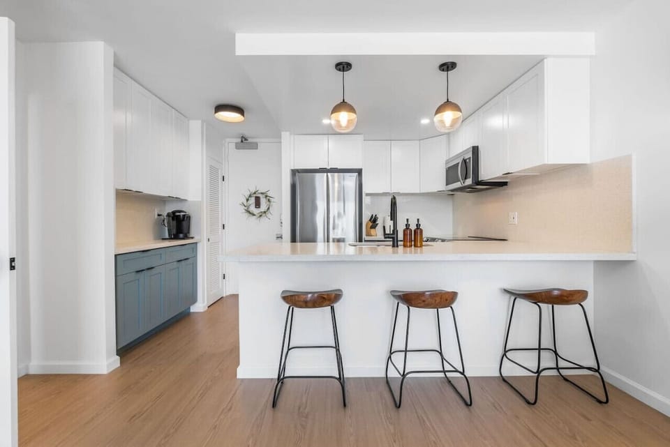 Newly renovated kitchen with brand new appliances, countertops, and fully stocked with pots/pans, dinnerware, and Keurig coffee station