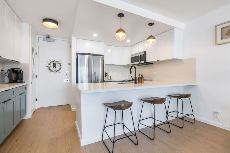 Newly renovated kitchen with brand new appliances, countertops, and fully stocked with pots/pans, dinnerware, and Keurig coffee station