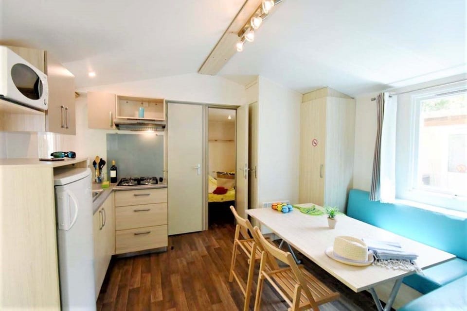 A bright, fully-equipped tiny home kitchen.