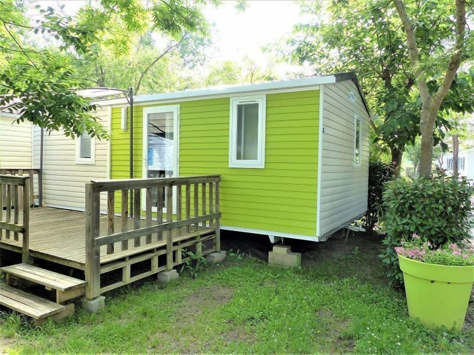 The tiny home enjoys a tranquil garden setting.