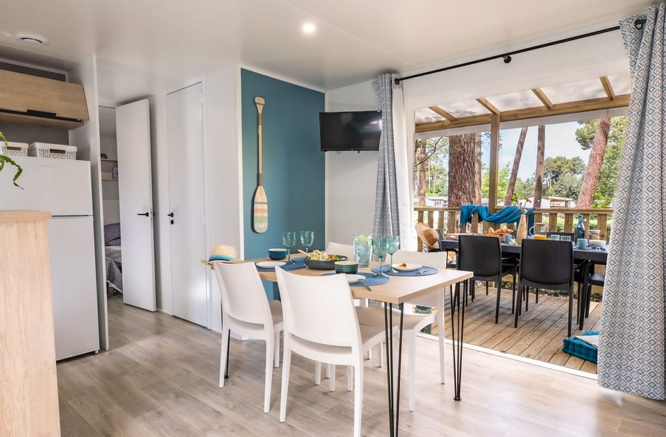 Spacious dining space with plenty of natural light, creating a warm and inviting atmosphere.