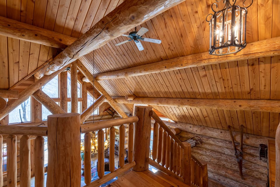 Soaring vaulted ceilings and hand-hewn log beams overhead -- the loft at Buffalo Creek Lodge is pure Blue Ridge craftsmanship.