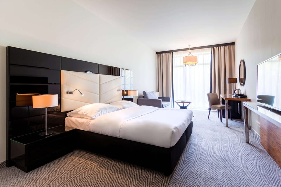 Standard Quadruple Room, Partial Sea View (Partial Sea View) | Hypo-allergenic bedding, minibar, in-room safe, desk