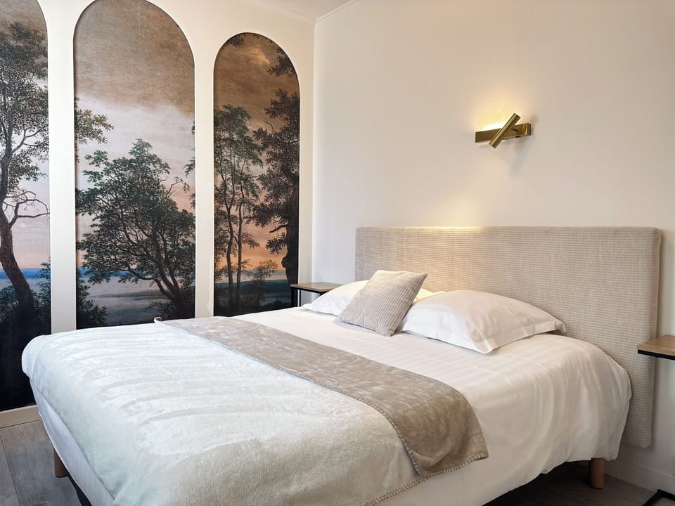 Family Room | Desk, laptop workspace, bed sheets
