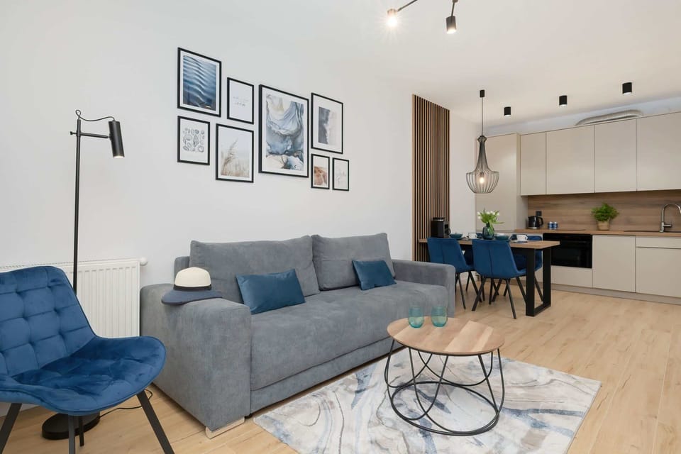 A living and dining area blending functionality with style, featuring coordinated furniture and decor.
