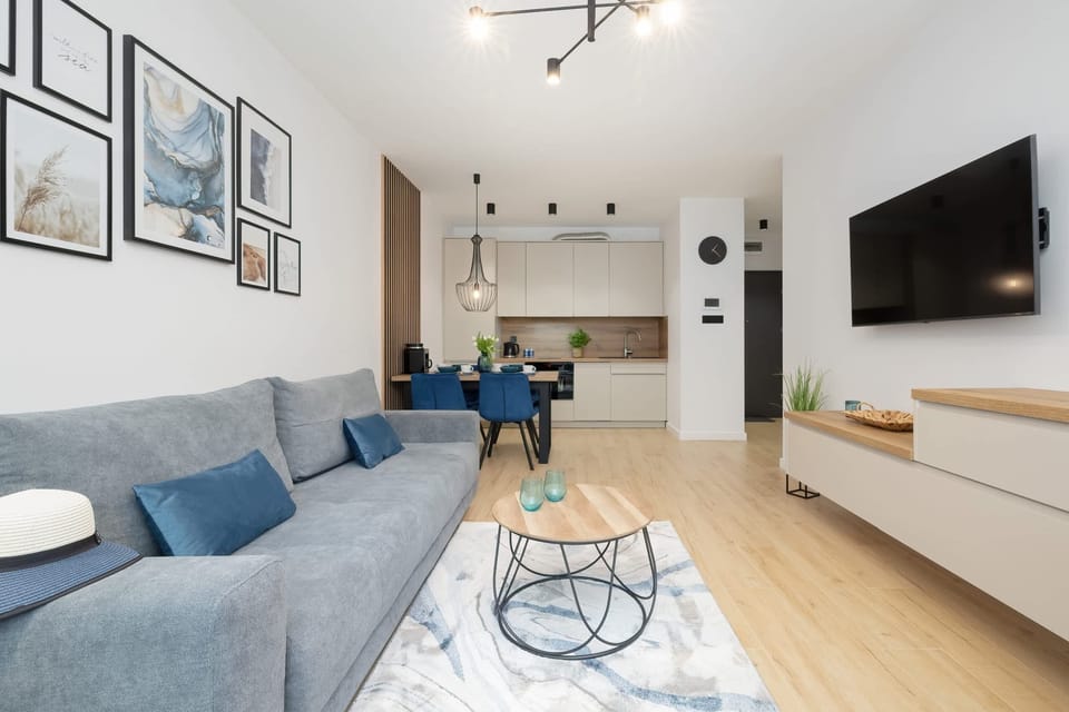 A wide-angle view of the living room, showcasing its open layout and modern design.
