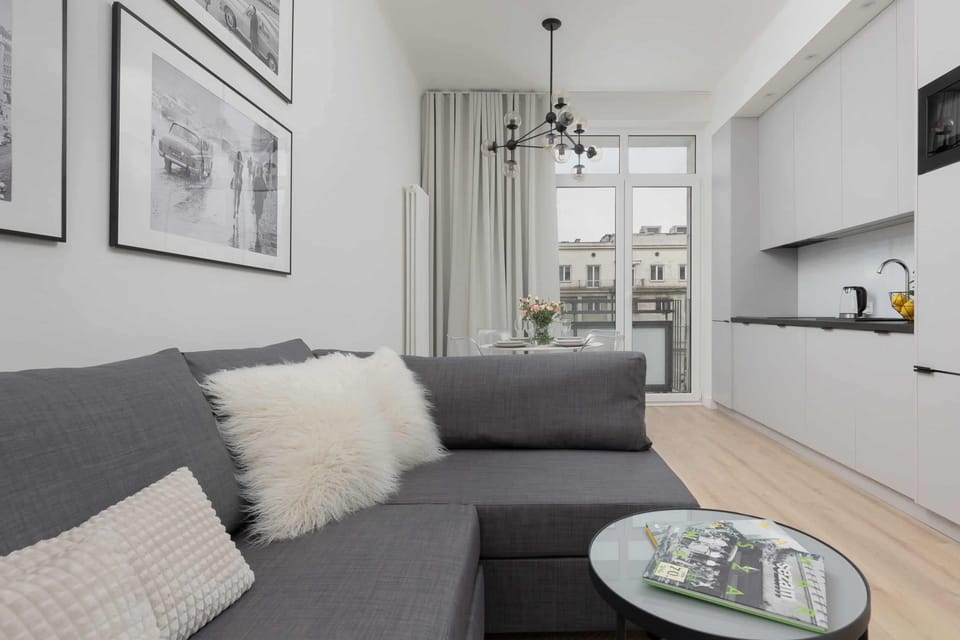 A comfortable seating area with a soft gray sofa and stylish decor.
