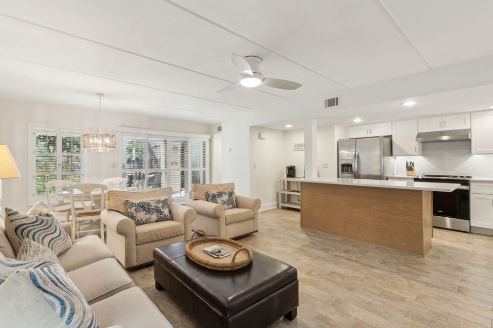 Sunny Living and Dining Area with Sliding Glass Doors to Covered Patio