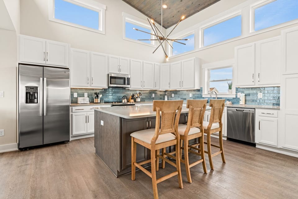 Kitchen with Bar Seating on Third Level