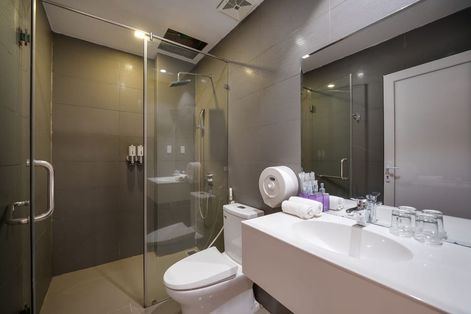 Shower, rainfall showerhead, designer toiletries, hair dryer