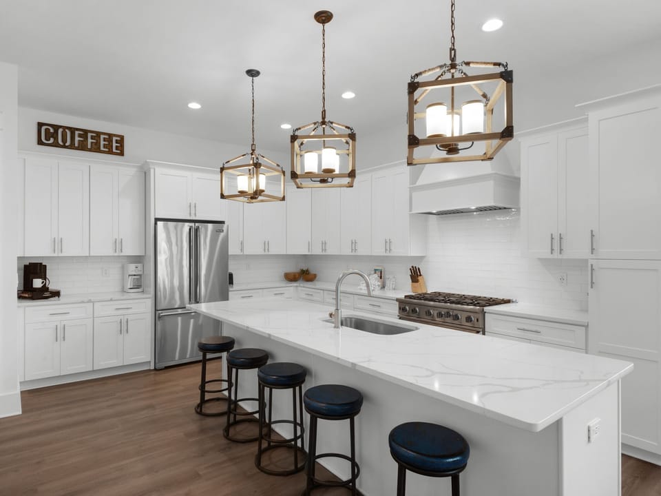 Modern open kitchen offering plenty of space for preparing meals and gathering. Located on 2nd floor living area.
