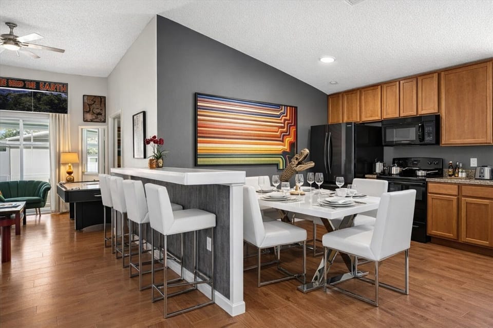 Spend quality time in the modern kitchen and dining area with a large breakfast bar and seating for eleven