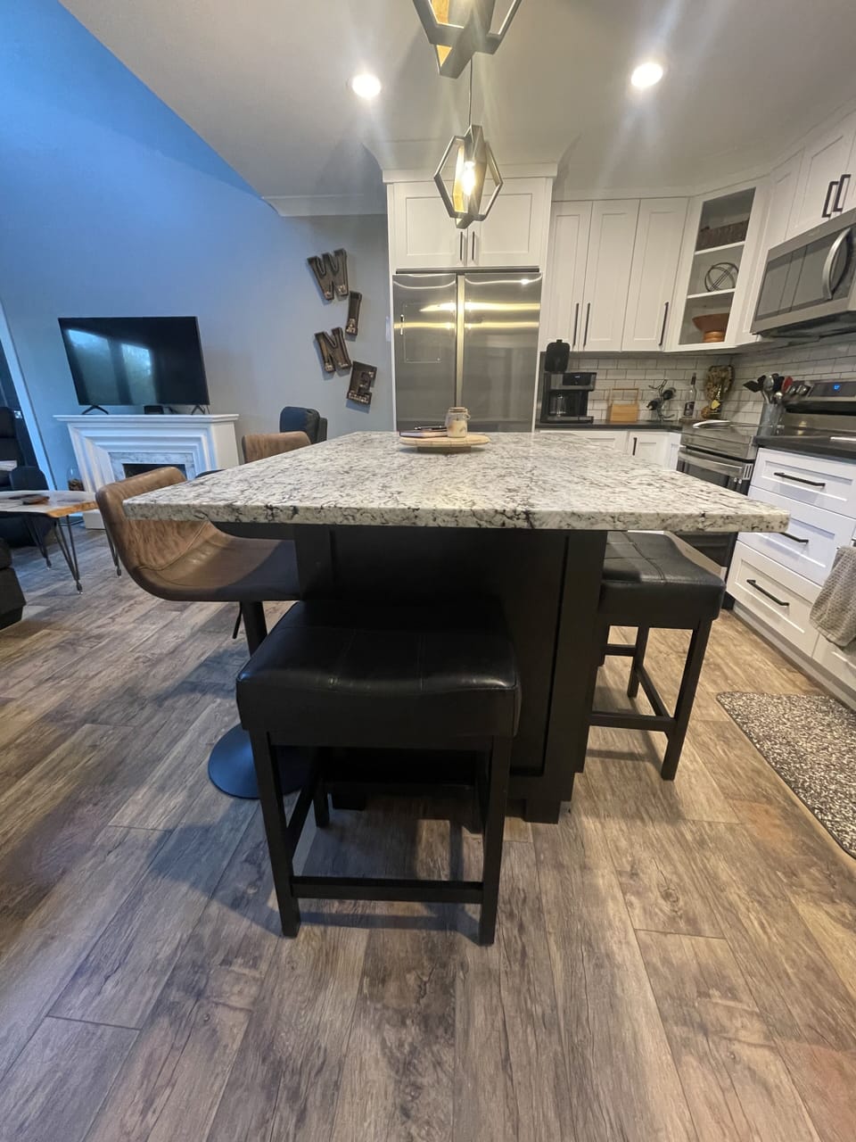 Kitchen with island seating up to 8 with additional stools