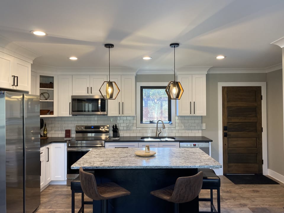 Fully stocked kitchen & view of front door