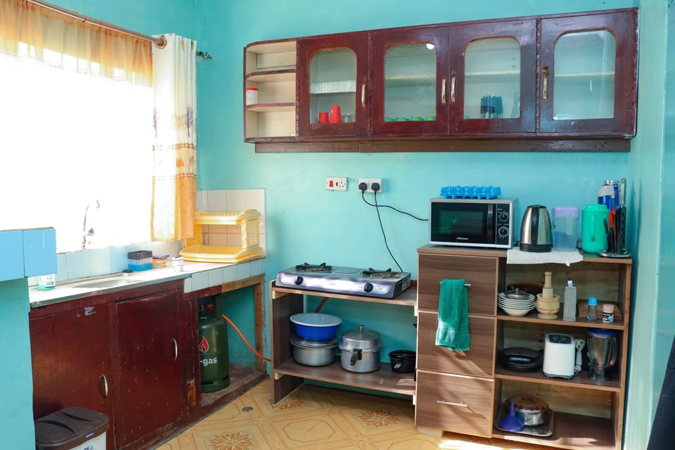 Family Room | Private kitchen | Shared fridge, microwave, dining tables