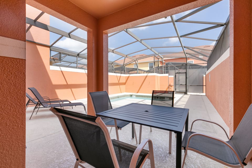 Enjoy outdoor dining with our furnished patio featuring a table and chairs.