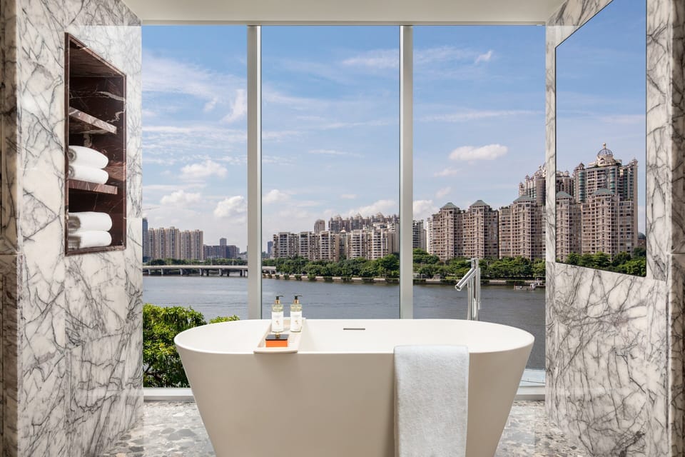 Suite, 1 Bedroom, River View (Dining Area) | Bathroom | Rainfall showerhead, free toiletries, hair dryer, bathrobes