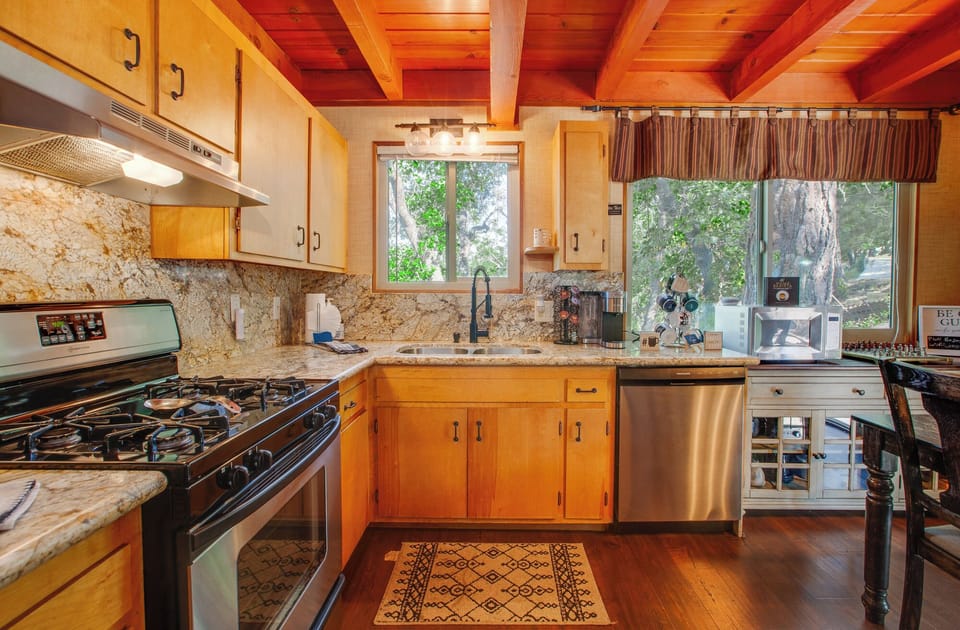 Fully equipped kitchen with 4 burner gas stove, oven, dishwasher and microwave.