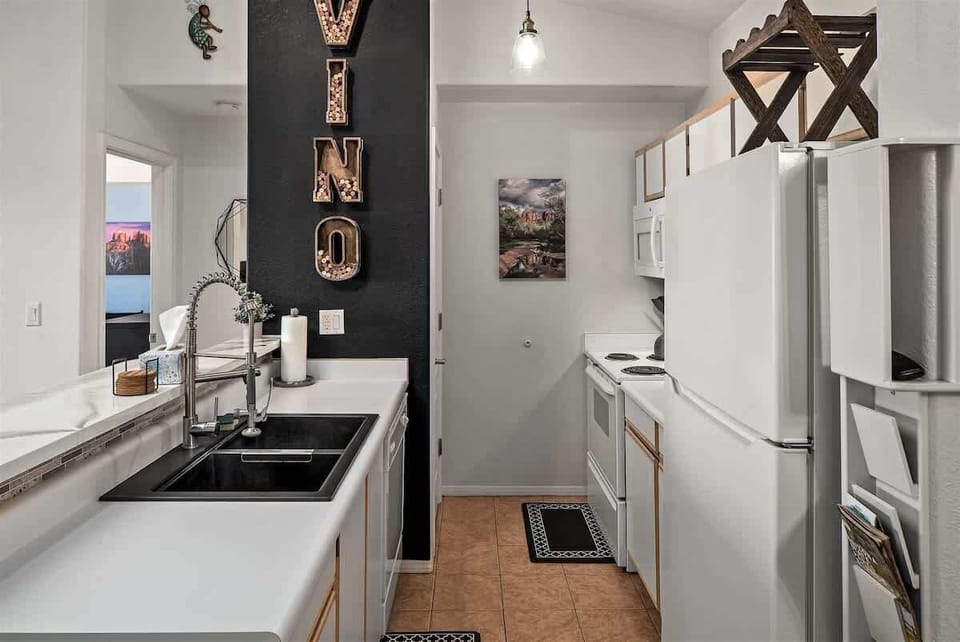 The kitchen is modern and well equipped