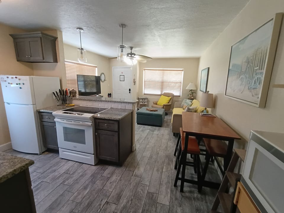 Open kitchen to cook and enjoy conversation with breakfast bar and living room