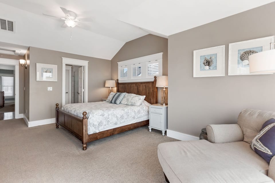 Drift off to the sound of the waves in this spacious top-level master suite with tranquil beach vibes.